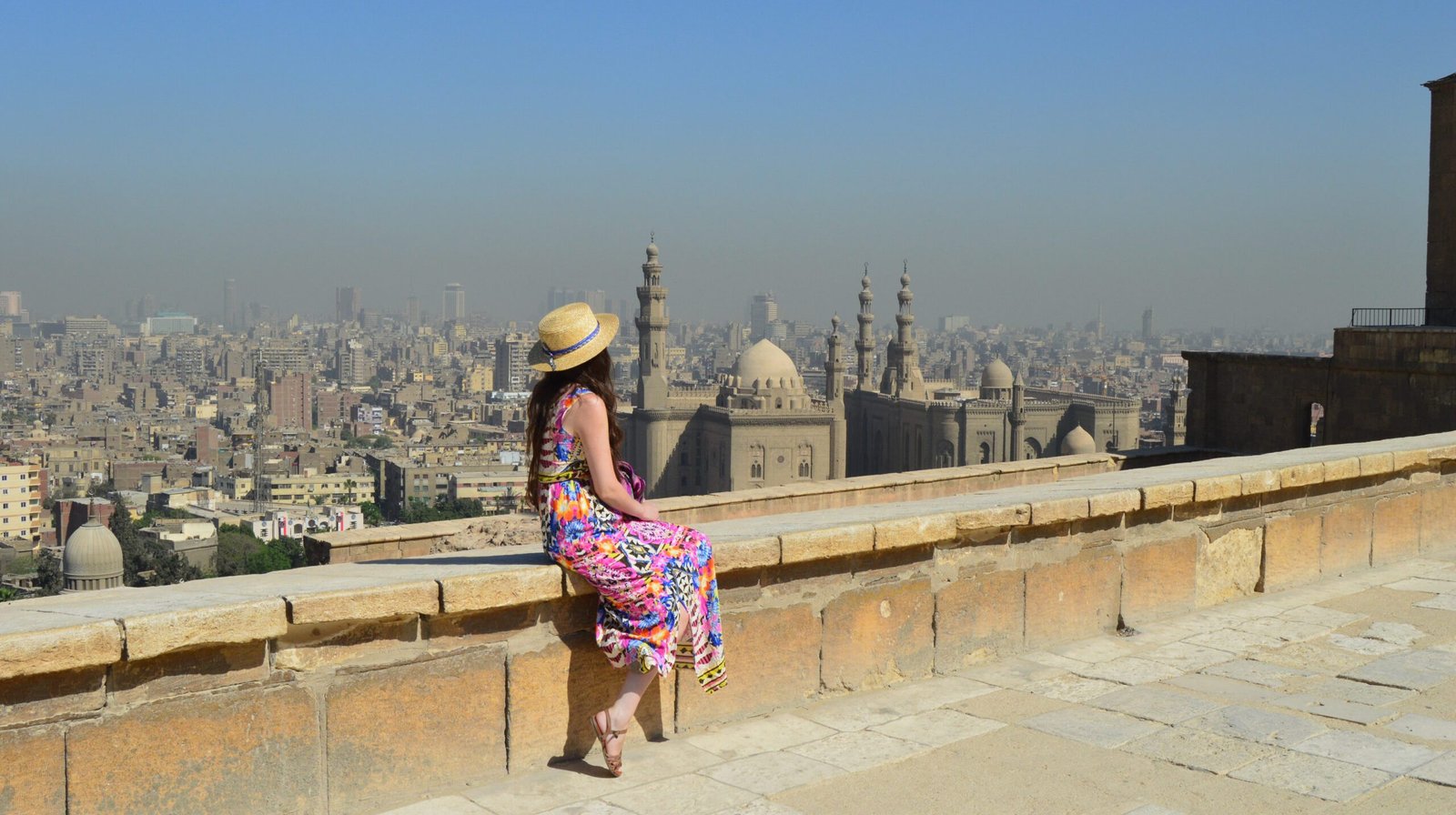 A young female tourist enjoying the beautiful view of ancient Citadel El-Khalifa Egypt